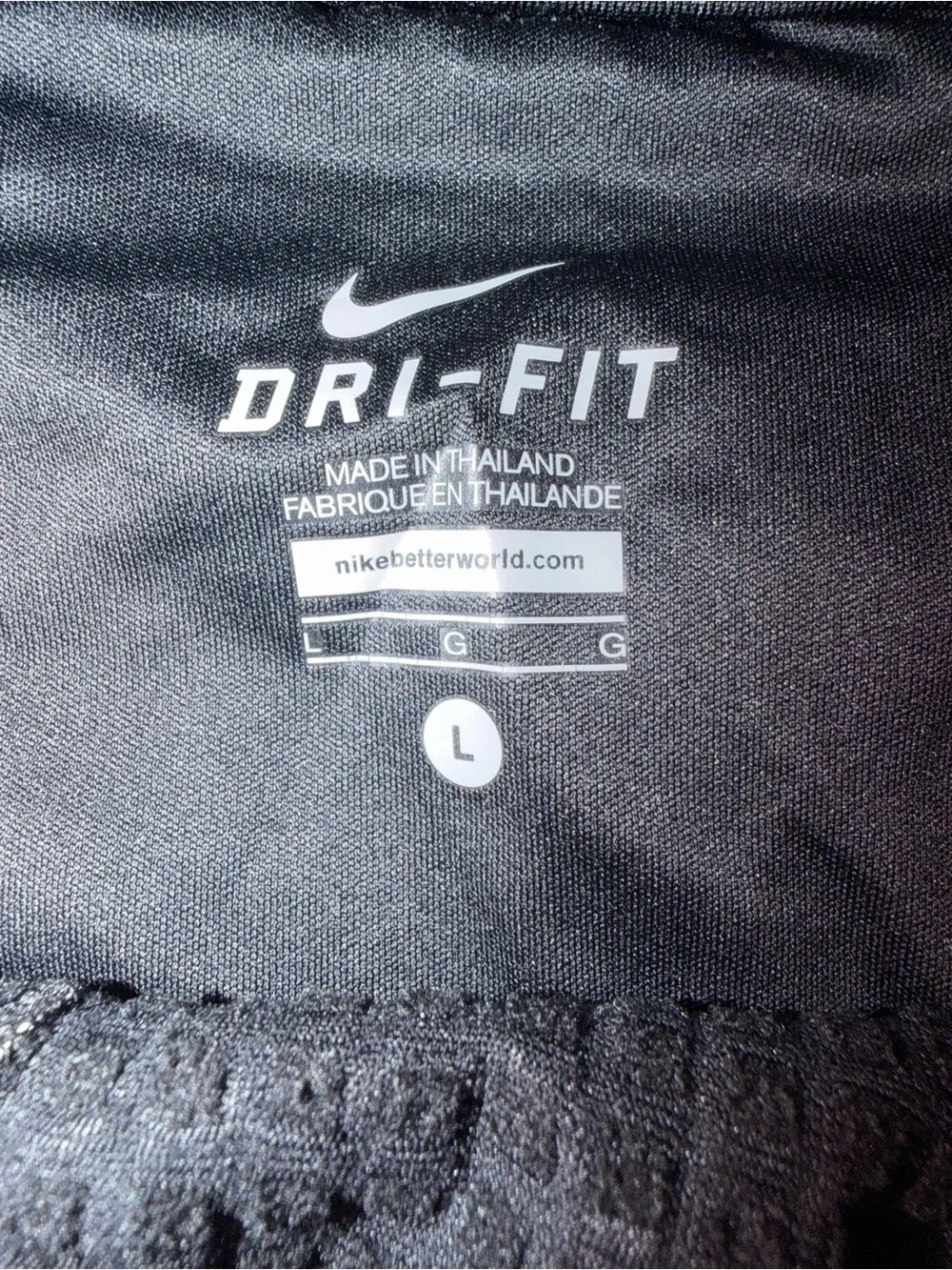 Nike Black Track Pants with White Swoosh and Reflective Details